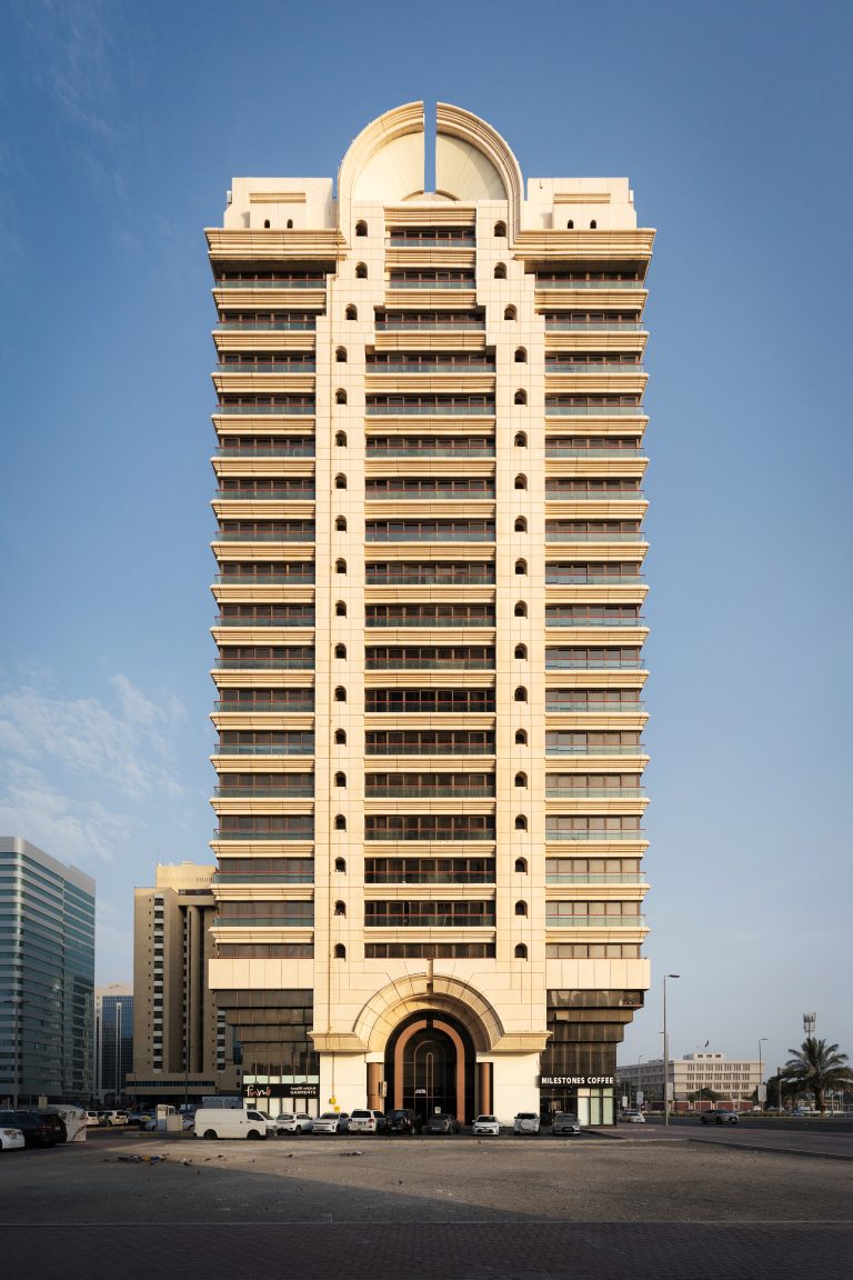 Exterior view of Al Manhal Tower in Abu Dhabi in evening light.